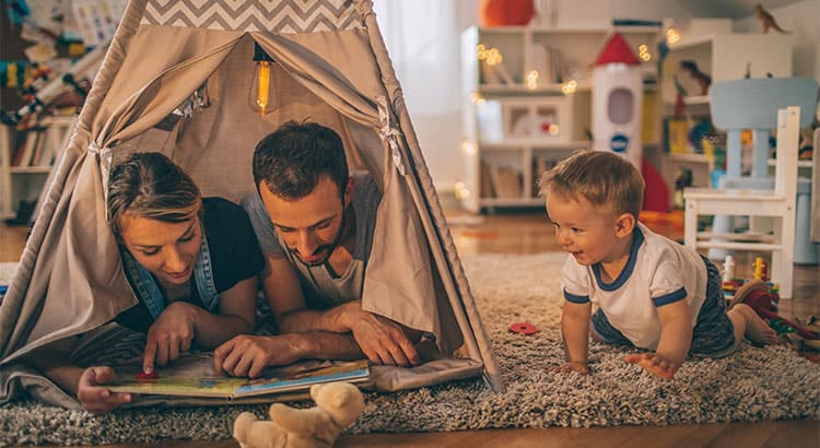 Parents playing with their baby boy