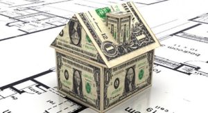 Toy model house made of money