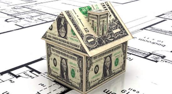 Toy model house made of money