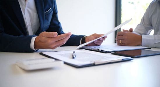 Two people discussing in table
