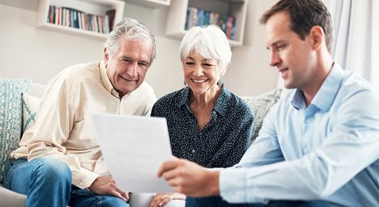 Professional discussing with senior couple
