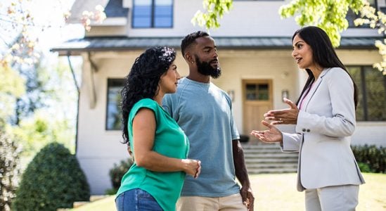 Professional discussing with young couple