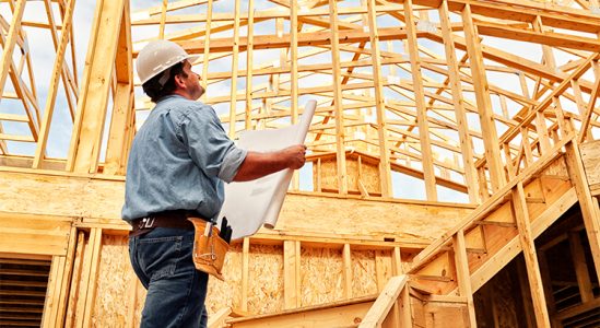 Engineer looking at a blueprint