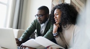 Young couple looking on the laptop