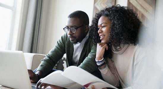 Young couple looking on the laptop