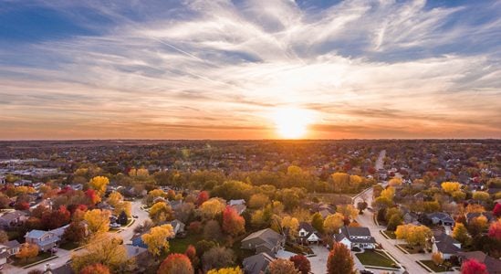 Aerial view of houses during sunset