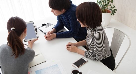 Professional discussing with young couple