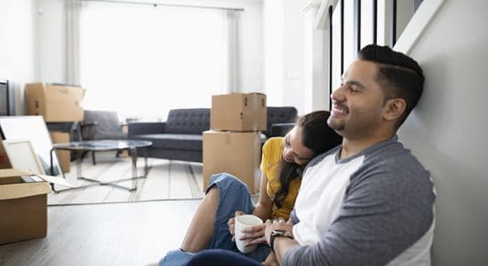 Young couple resting while moving in