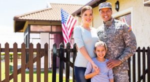 Mom, dad from military and son taking a family picture