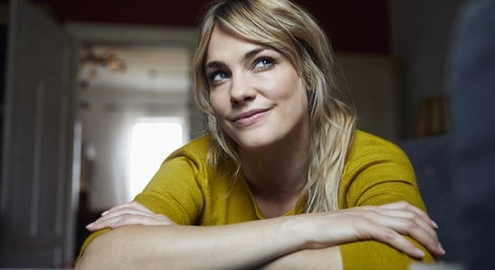 Woman smiling and wondering