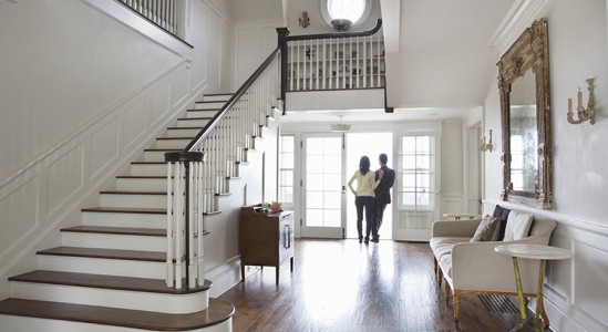 Young couple in the front door