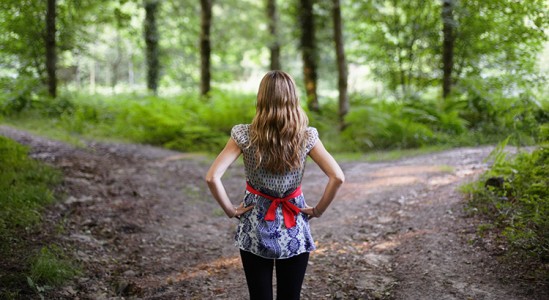 Woman on her back while looking at the trees