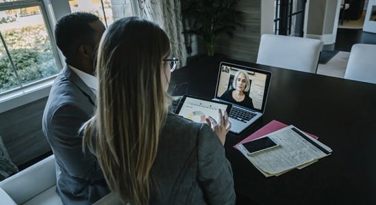 2 Professional doing video call with someone in the laptop