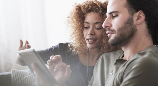 Young couple using tablet