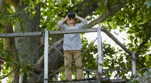 Kid using a telescope