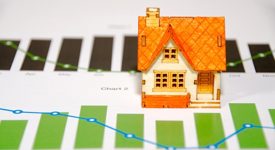 Toy model house with chart below