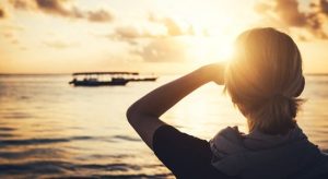 Silhouette of a person while waiting for sun to rise