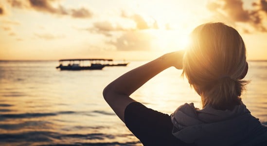 Silhouette of a person while waiting for sun to rise