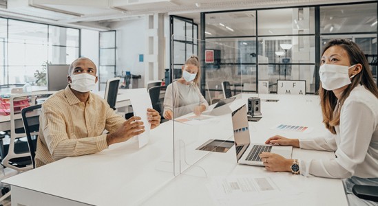 3 people in a office discussing