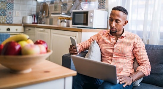 Man using laptop at home