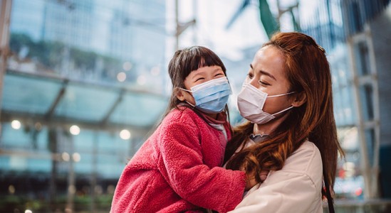 Mother and daughter wearing face masks