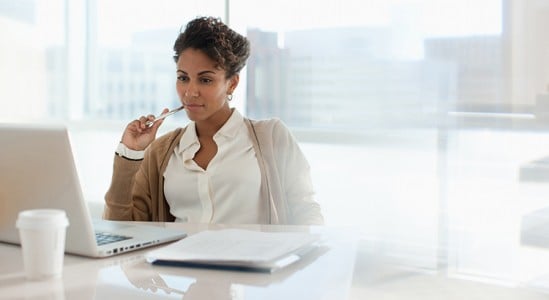 Young woman in her office table