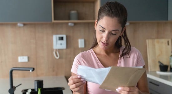 Woman reading a paper