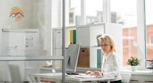Young women in the office using her computer