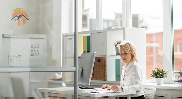 Young women in the office using her computer
