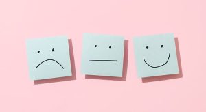Three Blue Sticky Blank Notes On Pink Background