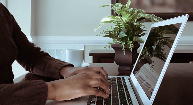 Woman Works on Laptop