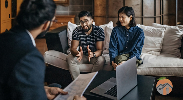 Professional discussing with young couple