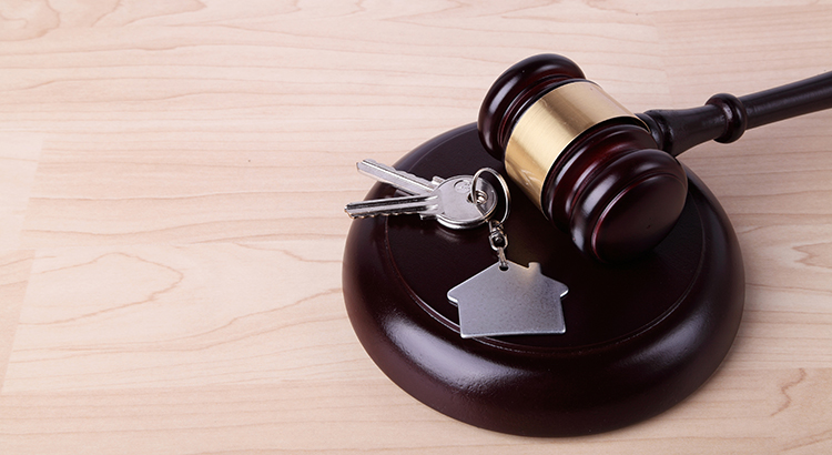 Key with house keychain attached