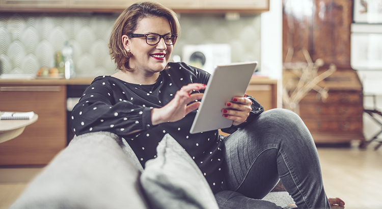 Portrait of a woman holding her tablet