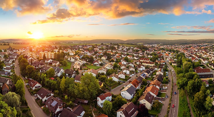 Aerial panorama of a small town at sunrise