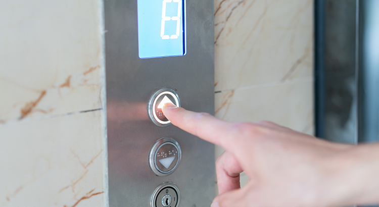 pointer finger pushing elevator button