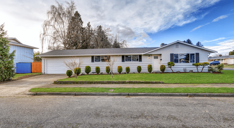 Single story home with grass front yard