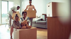 Family moving with moving boxes